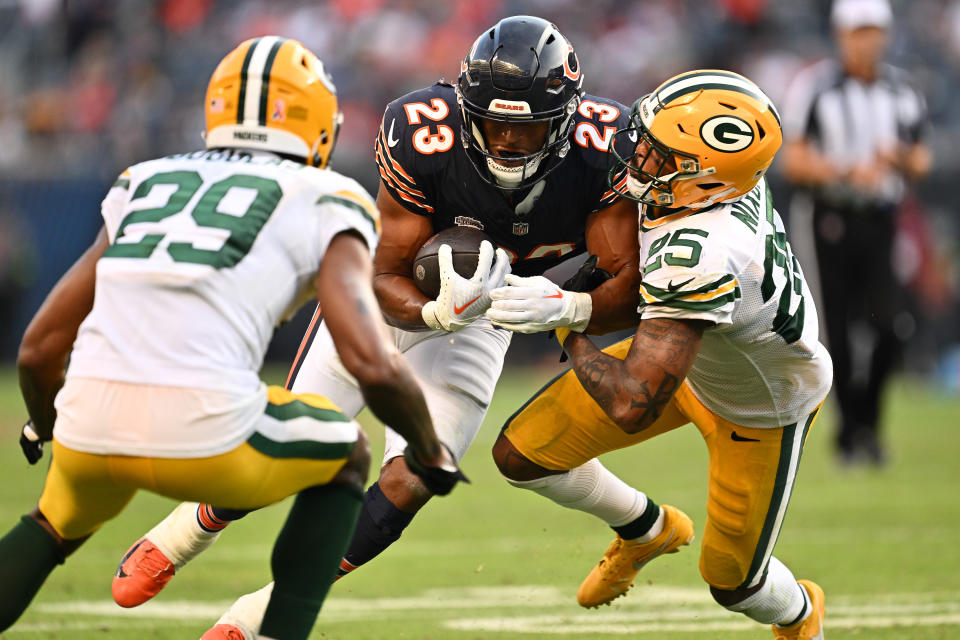 Sep 10, 2023; Chicago, Illinois, USA; Chicago Bears running back <a class="link " href="https://sports.yahoo.com/nfl/players/40162" data-i13n="sec:content-canvas;subsec:anchor_text;elm:context_link" data-ylk="slk:Roschon Johnson;sec:content-canvas;subsec:anchor_text;elm:context_link;itc:0">Roschon Johnson</a> (23) is brought down by Green Bay Packers cornerback <a class="link " href="https://sports.yahoo.com/nfl/players/32348" data-i13n="sec:content-canvas;subsec:anchor_text;elm:context_link" data-ylk="slk:Keisean Nixon;sec:content-canvas;subsec:anchor_text;elm:context_link;itc:0">Keisean Nixon</a> (25) and cornerback <a class="link " href="https://sports.yahoo.com/nfl/players/30212" data-i13n="sec:content-canvas;subsec:anchor_text;elm:context_link" data-ylk="slk:Rasul Douglas;sec:content-canvas;subsec:anchor_text;elm:context_link;itc:0">Rasul Douglas</a> (29) in the second half at Soldier Field. Mandatory Credit: Jamie Sabau-USA TODAY Sports