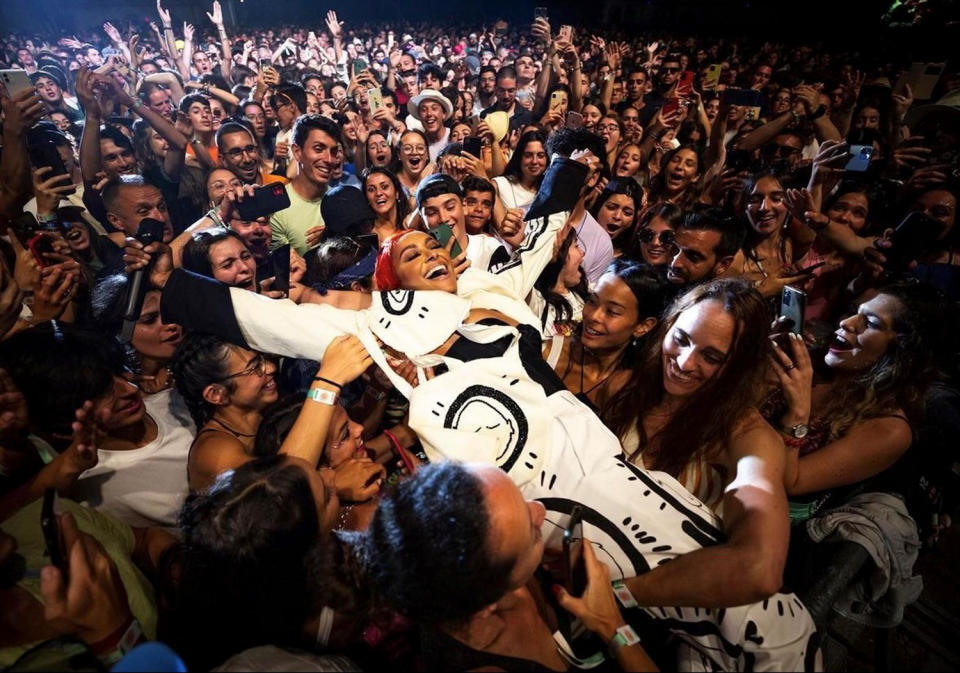 <p>Kat Graham crowd surfs during her show in Azores, Portugal, on July 25.</p>