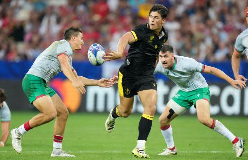 Louis Rees-Zammit<br>FILE - Wales' Louis Rees-Zammit, center, passes the ball during the Rugby World Cup Pool C match between Wales and Portugal in the Stade de Nice, in Nice, France, Sept. 16, 2023. Rees-Zammit, whose favorite NFL player growing up was three-time Pro Bowl wide receiver DeSean Jackson, is one of 16 athletes from eight countries participating in the NFL International Player Pathway program. It was established in 2017 to provide elite athletes from around the world the opportunity to earn a spot on an NFL roster and increase the number of international players in the league. (AP Photo/Pavel Golovkin, File)