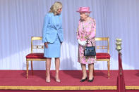 <p>The Queen wore a pink floral print dress by Stewart Parvin and a matching hat by Rachel Trevor-Morgan for the historic meeting.</p>