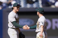 Oakland Athletics' Zack Gelof, left, celebrates with Nick Allen after the baseball game against the New York Yankees at Yankee Stadium Monday, April 22, 2024, in New York. The Athletics defeated the Yankees 2-0. (AP Photo/Seth Wenig)