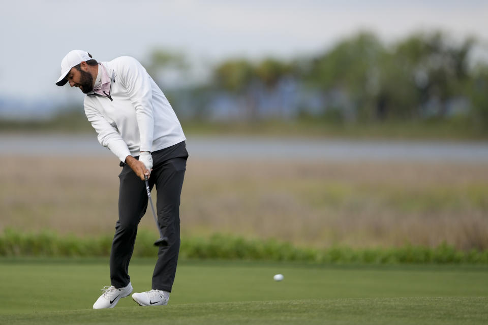 Scottie Scheffler hits from the fairway on the 18th hole during the completion of the weather delayed final round at the RBC Heritage golf tournament, Monday, April 22, 2024, in Hilton Head Island, S.C. (AP Photo/Chris Carlson)