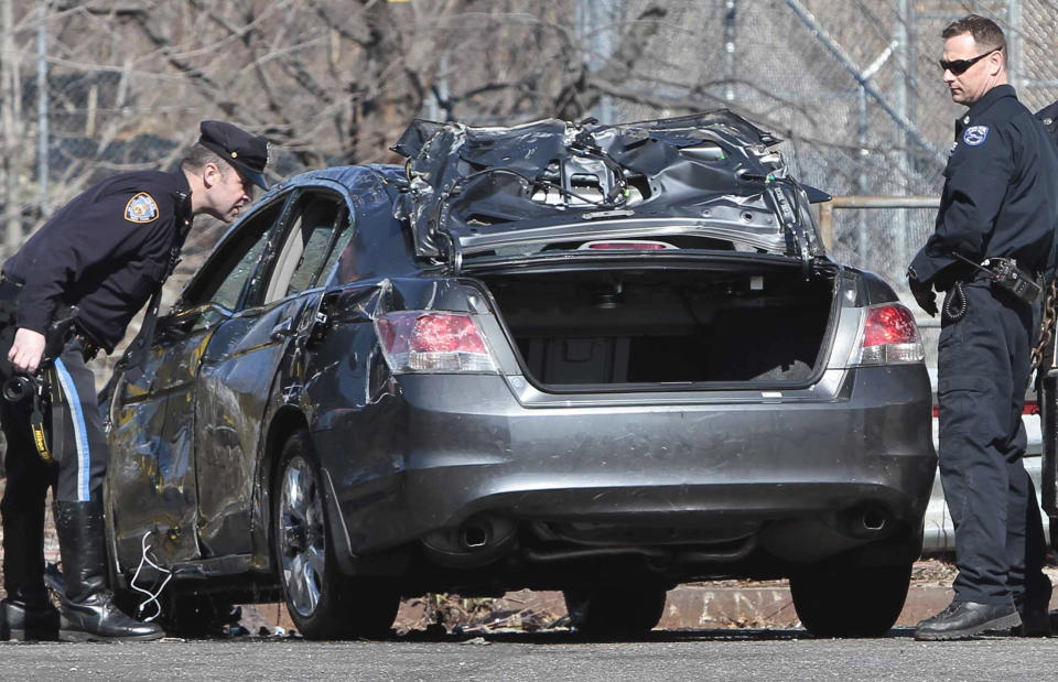 Police investigate a 2009 Honda Accord recovered from the Steinway Creek on Saturday April 5, 2014 in New York. The driver of the car drove off a dead-end street in a desolate industrial area, flipped over a wooden curb into the East River inlet killing four passengers. The driver escaped serious injury and told officers at the scene in the Astoria section of Queens that the four were trapped in the submerged car. Fire department divers pulled the four victims from the car. Police identified them as 21-year-old Darius Fletcher, 19-year-old Jada Monique Butts, 19-year-old Crystal Gravely and 20-year-old Jaleel Furtado. They were pronounced dead at hospitals. (AP Photo/Bebeto Matthews)