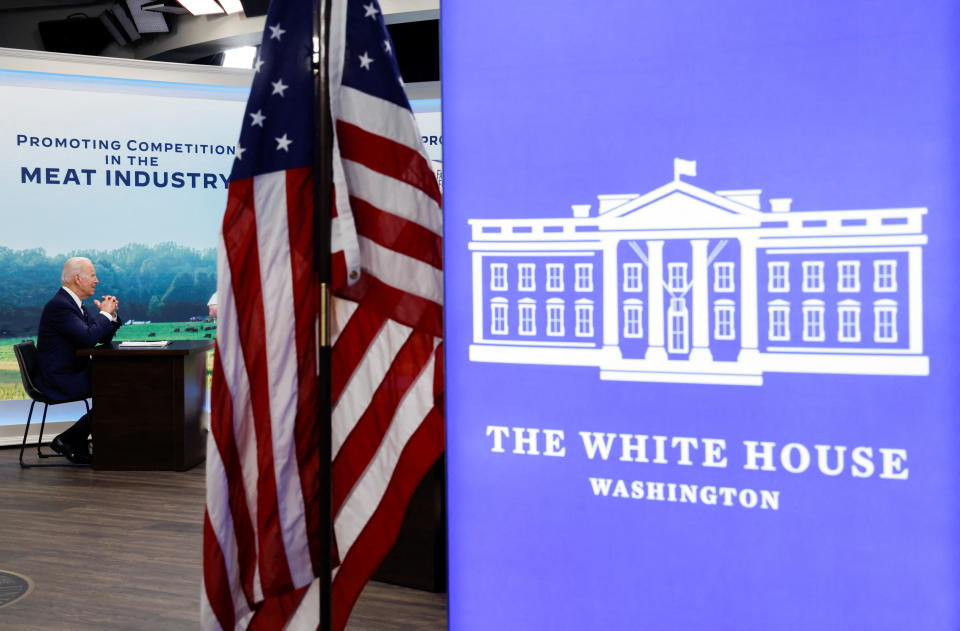 U.S. President Joe Biden holds a video conference with farmers, ranchers and meat processors to discuss meat and poultry supply chain issues, from an auditorium on the White House campus in Washington, U.S. January 3, 2022. REUTERS/Jonathan Ernst