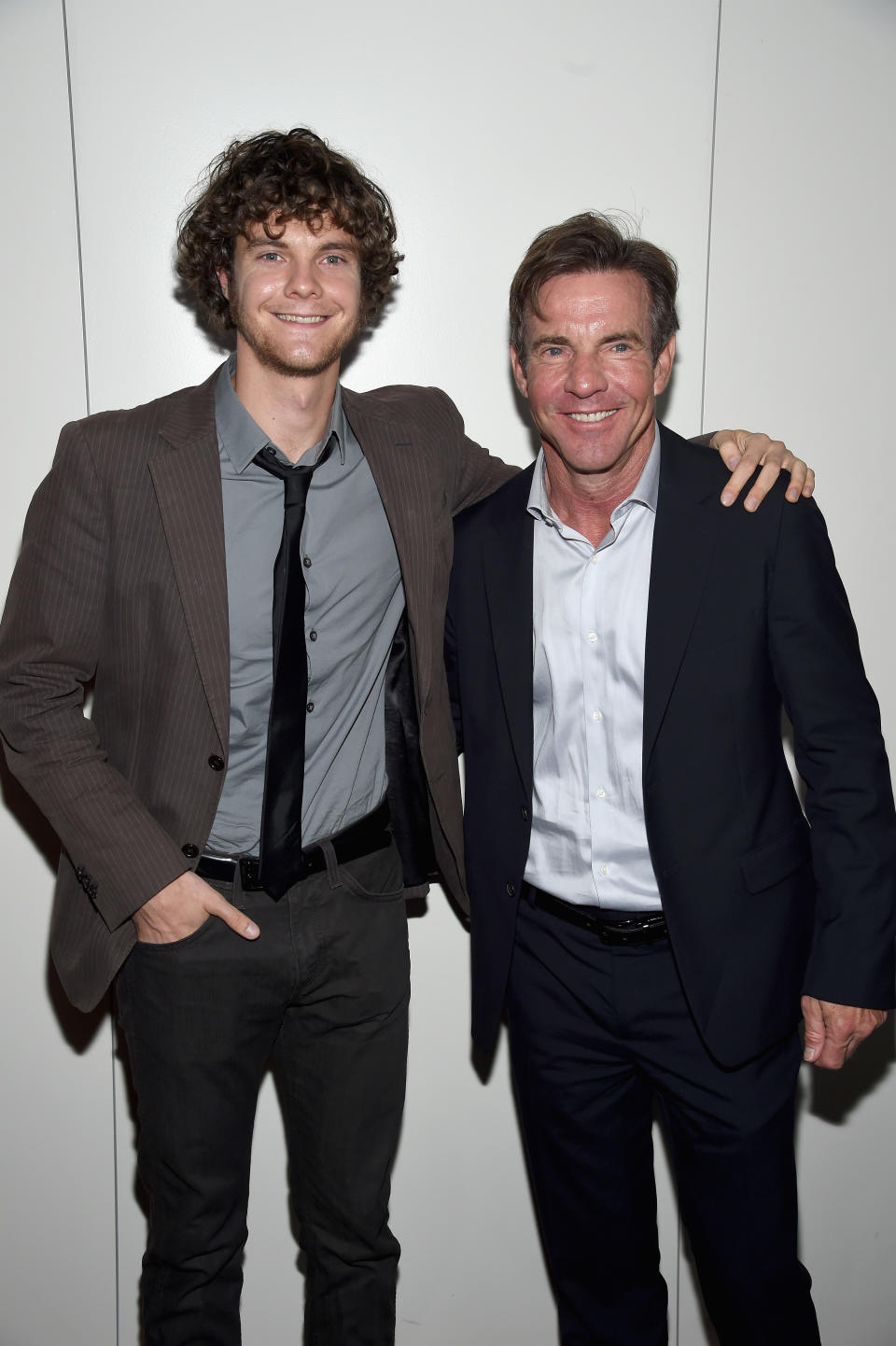 Jack Quaid and Dennis Quaid with their arms around each other