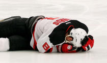 NEW YORK, NY - MAY 23: Dainius Zubrus #8 of the New Jersey Devils hold his head on the ice in Game Five of the Eastern Conference Final against the New York Rangers during the 2012 NHL Stanley Cup Playoffs at Madison Square Garden on May 23, 2012 in New York City. (Photo by Bruce Bennett/Getty Images)