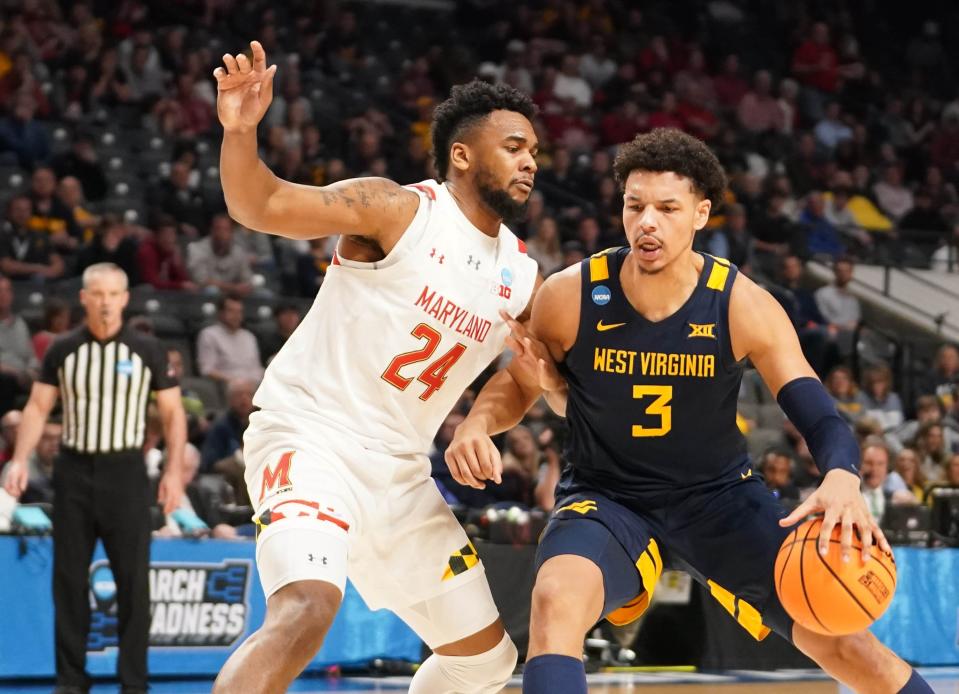 West Virginia Mountaineers forward Tre Mitchell (3) dribbles against Maryland Terrapins forward Donta Scott (24) during the first half in the first round of the 2023 NCAA Tournament at Legacy Arena on Mar 16, 2023 in Birmingham, AL.