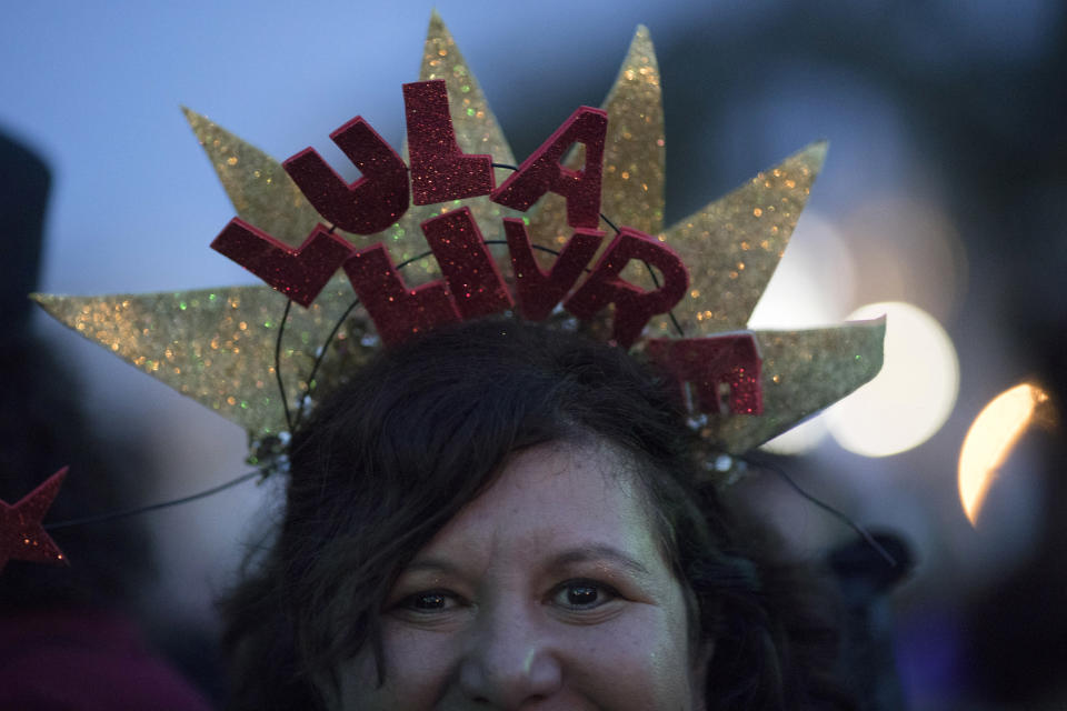 A woman wears a crown with a message that reads in Portuguese: "Lula Free" during the Lula Free festival, in Rio de Janeiro, Brazil, Saturday, July 28, 2018. Popular Brazilian musicians and social movements organized a concert to call for the release of Brazil's former president Luiz Inacio Lula da Silva, who has been in prison since April, but continues to lead the preferences on the polls ahead of October's election. (AP Photo/Leo Correa)