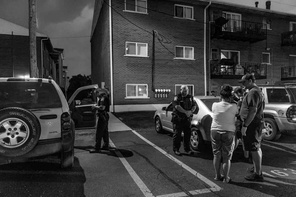 <p>In the parking lot outside Old Crow Bar, the Middletown Fire Department responds to a call about a possible heroin overdose. The woman insists that she’s fine — she doesn’t want to go to the hospital. (Photograph by Mary F. Calvert for Yahoo News) </p>