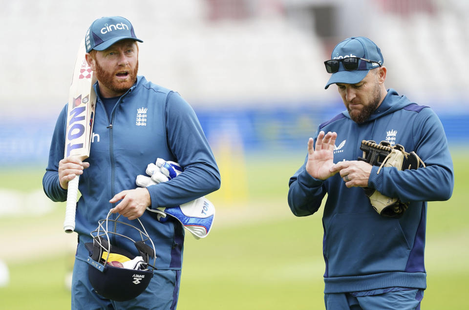 England's Jonny Bairstow and head coach Brendon McCullum during a nets session at the Emirates Old Trafford, Manchester, Britain, Tuesday July 18, 2023. (Mike Egerton/PA via AP)