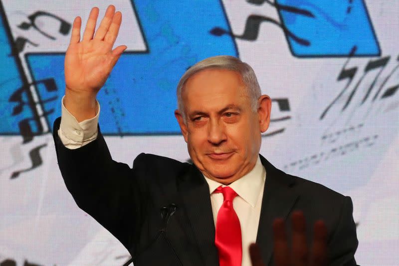 FILE PHOTO: Israeli Prime Minister Benjamin Netanyahu gestures as he delivers a speech to supporters following the announcement of exit polls in Israel's general election at his Likud party headquarters in Jerusalem