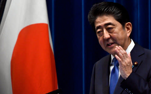 Japanese Prime Minister Shinzo Abe delivers a press conference at his official residence in Tokyo - Credit: EPA/FRANCK ROBICHON