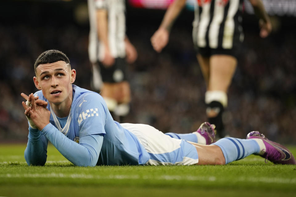 Manchester City's Phil Foden reacts after missing a scoring chance during the FA Cup quarterfinal soccer match between Manchester City and Newcastle at the Etihad Stadium in Manchester, England, Saturday, March 16, 2024. (AP Photo/Dave Thompson, Pool)