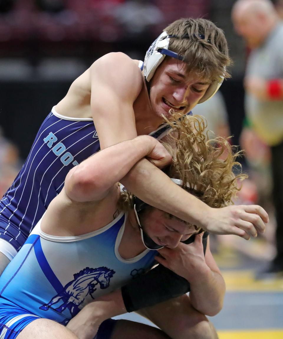 Tristan McKibben of Rootstown, top, wrestles Trenton Gatchell of Allen East during their 157-pound Division III match in the prelims of the 2024 OHSAA State Wrestling Tournament, Friday, March 8, 2024, in Columbus.