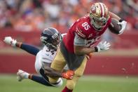 December 9, 2018; Santa Clara, CA, USA; San Francisco 49ers tight end George Kittle (85) is tackled by Denver Broncos strong safety Will Parks (34) during the first quarter at Levi's Stadium. Kyle Terada-USA TODAY Sports