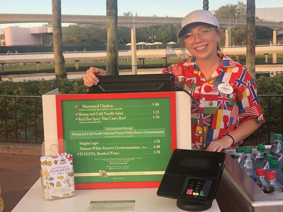 jordyn working behind a register at the epcot world showcase in disney world