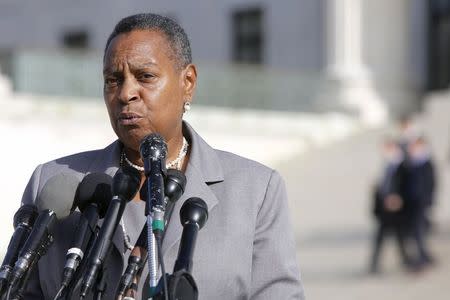 National Network to End Domestic Violence Vice President Paulette Sullivan Moore speaks with reporters about victims' rights after arguments in the case of Anthony Elonis, who was convicted in 2010 on the grounds of threatening his wife via social media, at the Supreme Court building in Washington December 1, 2014. REUTERS/Jonathan Ernst