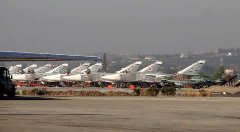 A general view shows Russian fighter jets on the tarmac at the Russian Hmeimim military base in Latakia province, in the northwest of Syria - Credit: AFP