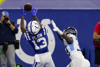 Indianapolis Colts wide receiver T.Y. Hilton (13) makes a catch for a touchdown in front of Tennessee Titans cornerback Breon Borders (39) in the second half of an NFL football game in Indianapolis, Sunday, Nov. 29, 2020. (AP Photo/Darron Cummings)