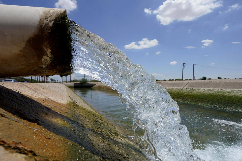 FILE - Water from the Colorado River, diverted through the Central Arizona Project, fills an irrigation canal, Thursday, Aug. 18, 2022, in Maricopa, Ariz. Nevada lawmakers on Monday, March 13, 2023, will consider another shift in water use for one of the driest major metropolitan areas in the U.S. The water agency that manages the Colorado River supply for Vegas is seeking authority to limit what comes out of residents' taps. (AP Photo/Matt York,File)