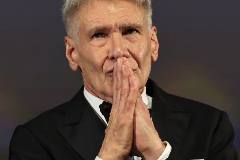 US actor Harrison Ford reacts on stage before being awarded with an Honourary Palme d'or prior to the screening of the film "Indiana Jones and the Dial of Destiny" during the 76th edition of the Cannes Film Festival in Cannes, southern France, on May 18, 2023. (Photo by Valery HACHE / AFP) (Photo by VALERY HACHE/AFP via Getty Images)