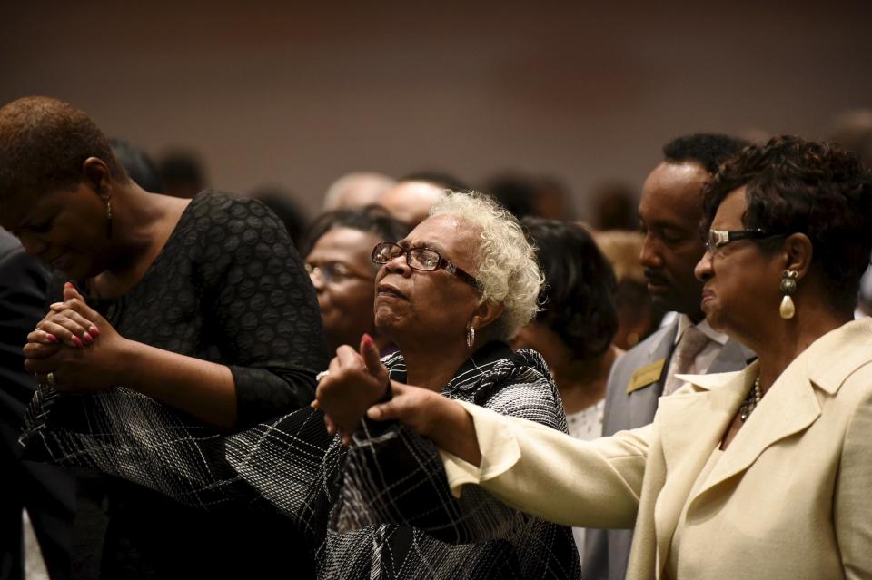 Members of the community pray during Sunday morning worship at New Shiloh Baptist Church, where Freddie Gray's April 27 funeral service was held in Baltimore, May 3, 2015. The city of Baltimore was on Sunday to observe a day of prayer two weeks after Gray, a 25-year-old black man, died of injuries suffered in police custody in a case that has led to criminal charges against six officers. REUTERS/Sait Serkan Gurbuz