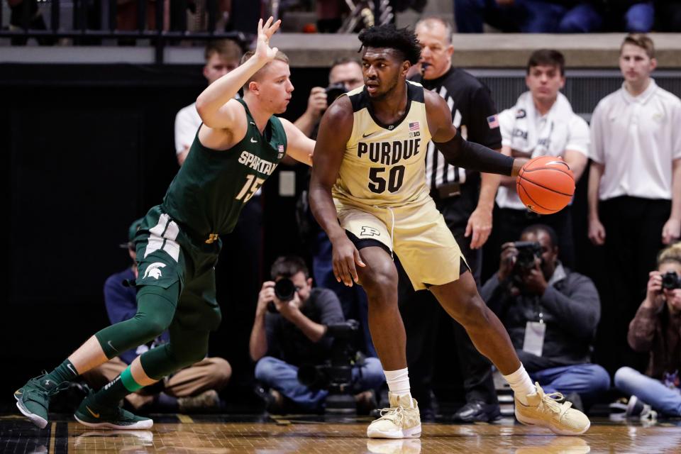 Purdue forward Trevion Williams drives on Michigan State forward Thomas Kithier during the first half on Sunday, Jan. 12, 2020, in West Lafayette, Ind.