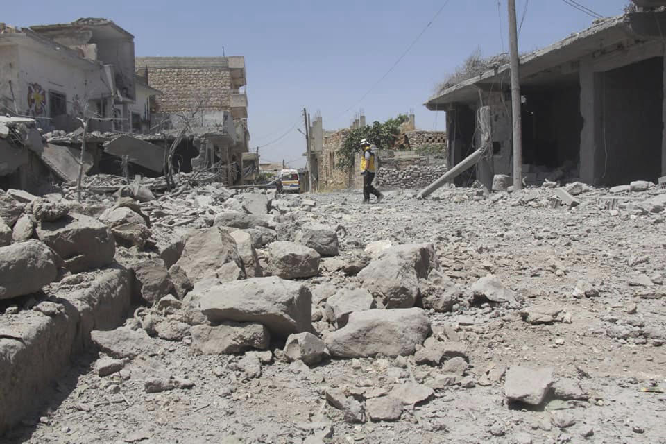 This photo posted and provided by the Syrian Civil Defense White Helmets, which has been authenticated based on its contents and other AP reporting, shows Civil Defense workers searching for victims under the rubble after an airstrike by Syrian government forces hit the village of Ehsim, in Jabal al-Zawiya, some 10 kilometers (6 miles) north of the town of Maarat al-Numan in Idlib, Syria, Monday, June 3, 2019. The Britain-based Syrian Observatory for Human Rights, an opposition war monitor, said on Monday that Syrian troops had reached Qassaibyeh, a village deep within the last rebel stronghold in the northwest province of Idlib, after intense clashes with militants. (Syrian Civil Defense White Helmets via AP)