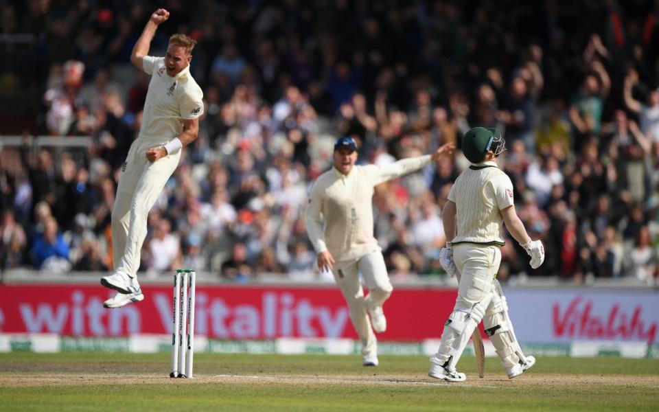 Australia batsman David Warner reacts as England bowler Stuart Broad celebrates his wicket - Getty Images