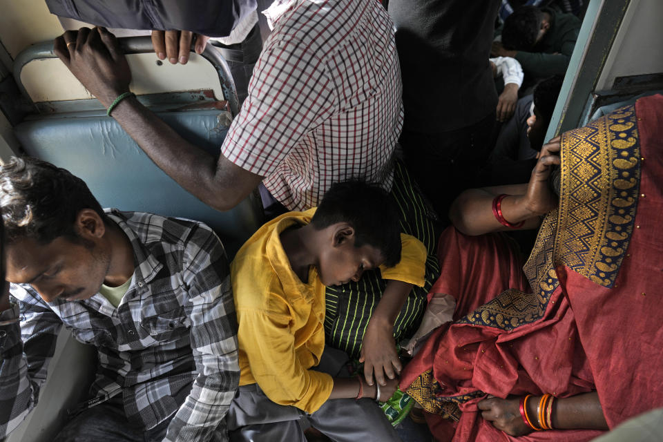 Passengers travel in a general compartment of the Thirukkural Express, India, Saturday, April 20, 2024. (AP Photo/Manish Swarup)