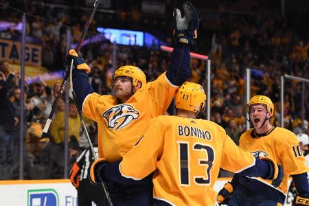 Nov 25, 2018; Nashville, TN, USA; Nashville Predators left wing Austin Watson (51) celebrates with Nashville Predators center Nick Bonino (13) and Nashville Predators center Colton Sissons (10) after a goal during the first period against the Anaheim Ducks at Bridgestone Arena. Mandatory Credit: Christopher Hanewinckel-USA TODAY Sports