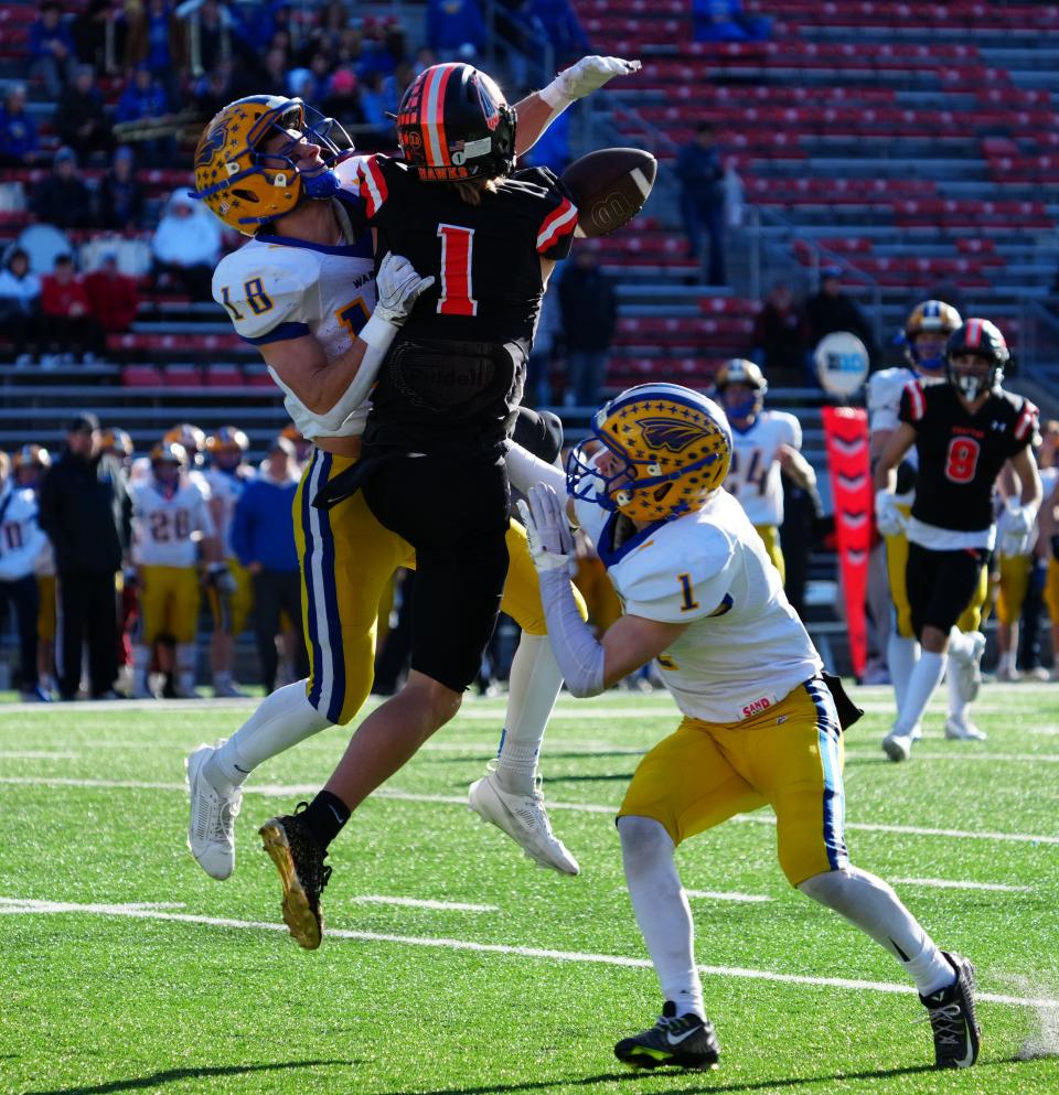 Rice Lake's Connor Durand (18) breaks up a pass intended for Grafton's Gavin Lempke (1) during the WIAA Division 3 state championship football game at Camp Randall Stadium in Madison on Friday, November 17, 2023.