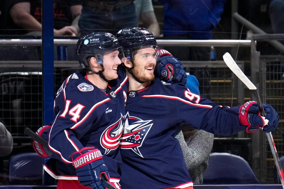 Oct 22, 2022; Columbus, Ohio, USA;  Columbus Blue Jackets forward Jack Roslovic (96) celebrates with Columbus Blue Jackets forward Gustav Nyquist (14) after scoring a goal during the first period of the hockey game between the Columbus Blue Jackets and the Pittsburgh Penguins at Nationwide Arena. Mandatory Credit: Joseph Scheller-The Columbus Dispatch