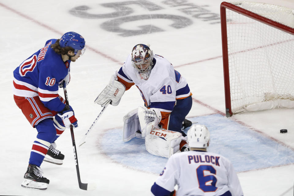 CORRECTS FINAL SCORE TO 6-2 NOT 6-1 New York Rangers left wing Artemi Panarin (10) watches his goal slide past New York Islanders goaltender Semyon Varlamov (40) during the third period of an NHL hockey game, Monday, Jan. 13, 2020, in New York. Panarin had two goals in the Rangers 6-2 victory over the Islanders. Islanders defenseman Ryan Pulock (6) watches. (AP Photo/Kathy Willens)