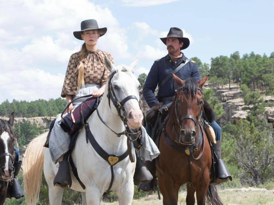 Pike as Rosalie Quaid and Christian Bale as Captain Joseph J. Blockern in 'Hostiles'