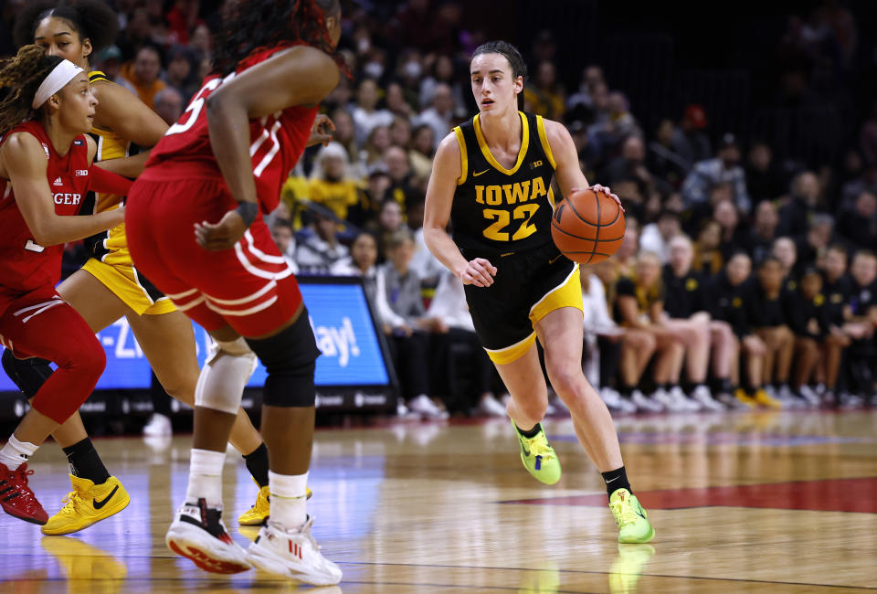 Iowa guard Caitlin Clark (22) drives to the basket against Rutgers during the first half of an NCAA college basketball game Friday, Jan. 5, 2024, in Piscataway, N.J. (AP Photo/Noah K. Murray)