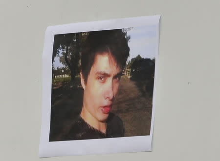 A picture of Elliot Rodger is displayed during a news conference by Santa Barbara County Sheriff Bill Brown (not shown) at Sheriff headquarters in Santa Barbara, California May 24, 2014. REUTERS/Phil Klein