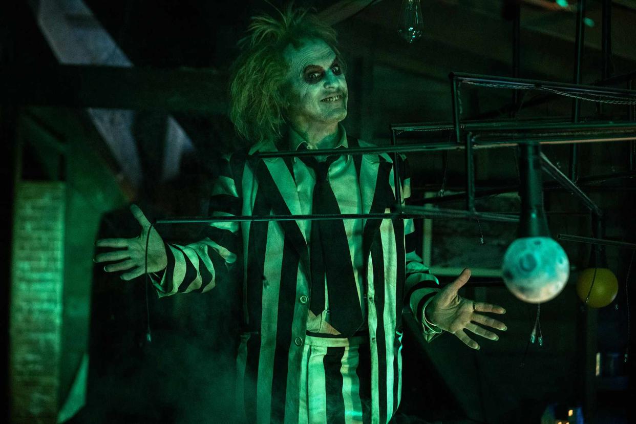 <p>Parisa Taghizadeh/Warner Bros.</p> Keaton as Beetlejuice, 26 years later.