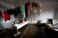 <p>In Batabano, Cuba, a girl lies on a bed in her flooded home on Sept. 27. </p>