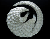 <p>Intricate paper cut out of a pangolin. (Photo: Patrick Cabral/Caters News </p>