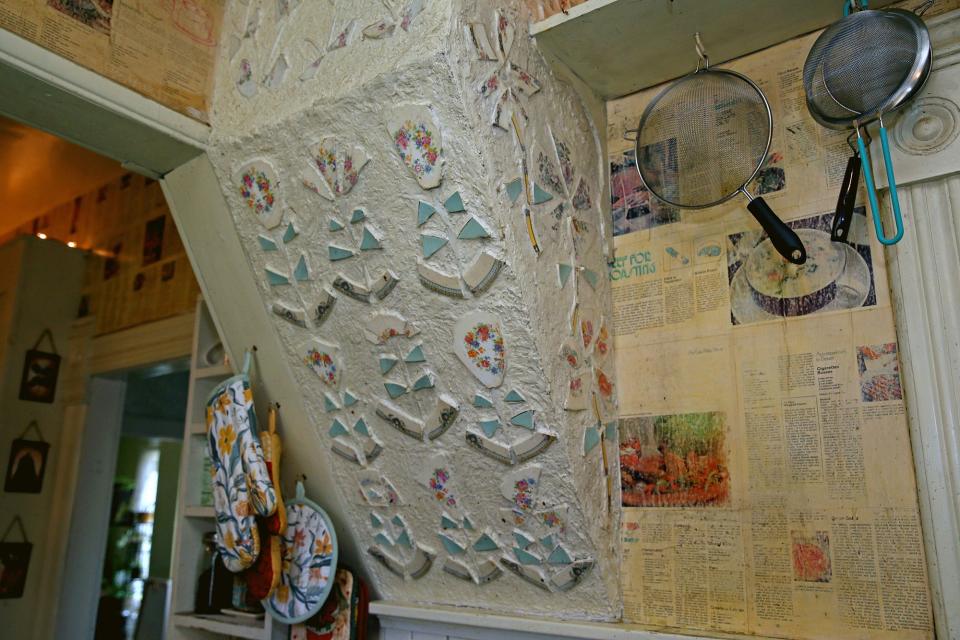 Nancy Lindsey-Janusz created floral patterns from broken plates and used recipes from cookbooks to create wallpaper in the kitchen of the farmhouse now owned by  Kathleen Stanislawski and Frank Paul.