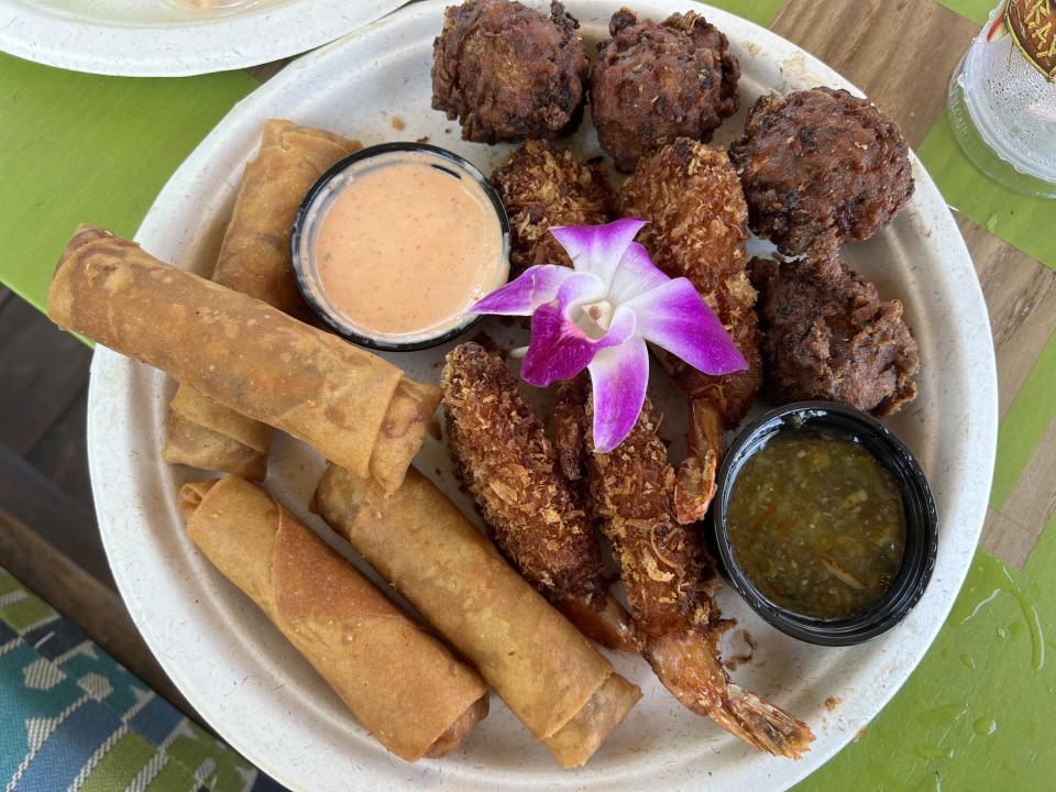 An appetizer platter, with delights like coconut shrimp and conch fritters, is available on the cabana guest menu. (Photo: Terri Peters)