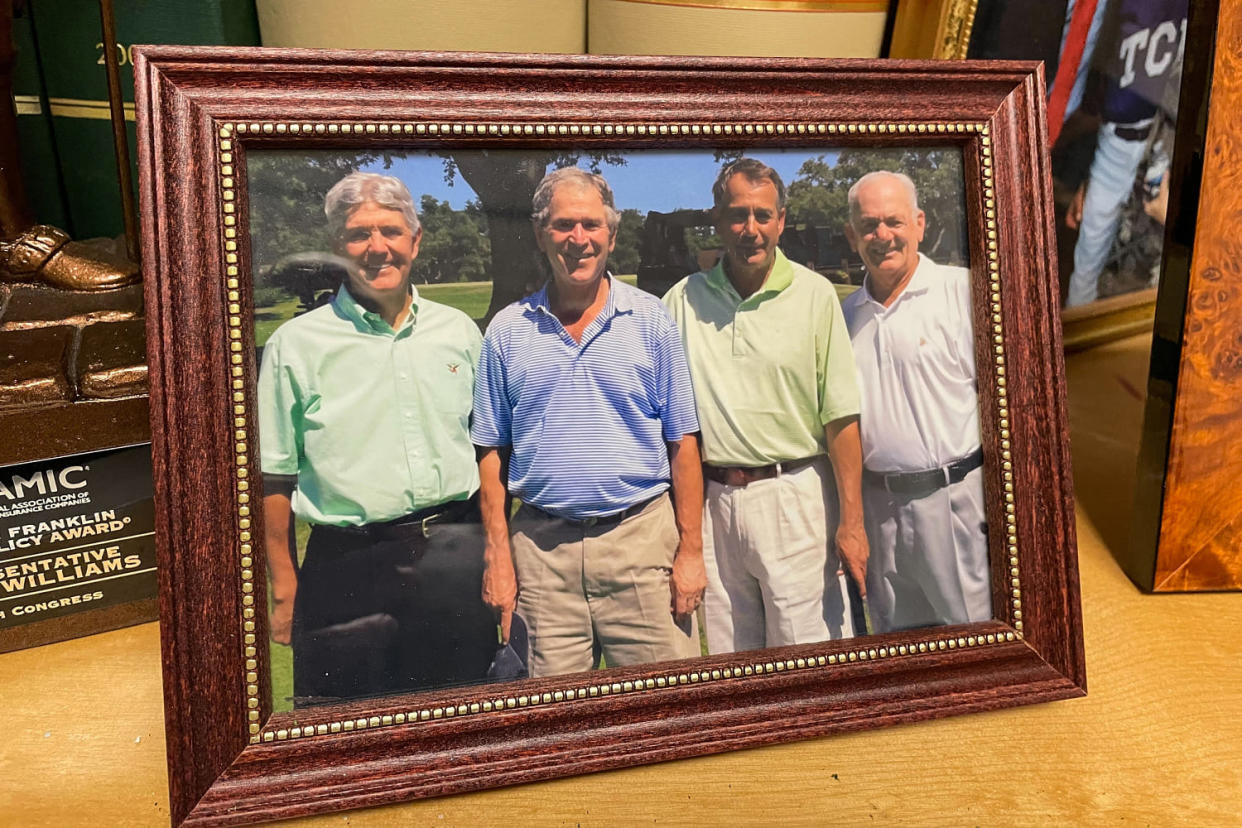 A framed photograph showing Rep. Roger Williams, left, President George W. Bush, and House Speaker John Boehner. (Scott Wong / NBC News)