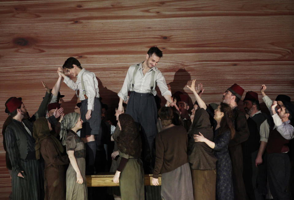 In this April 15, 2013 photo provided by the Brooklyn Academy of Music countertenor Pascal Charbonneau, upper right, performs the role of David with soprano Ana Quintans, upper left, in the role of Jonathas as the rest of the cast gathers below them during a final dress rehearsal of Charpentier’s opera "David et Jonathas," at the Brooklyn Academy of Music, in New York. (AP Photo/Brooklyn Academy of Music, Julieta Cervantes)
