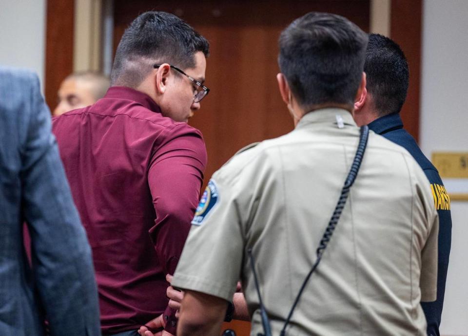 Raul Cuevas is handcuffed and lead away by guards at the Ada County Courthouse after being sentenced for killing Jesus Urrutia. A jury acquitted Cuevas on the first-degree murder charge but convicted him of second-degree murder.