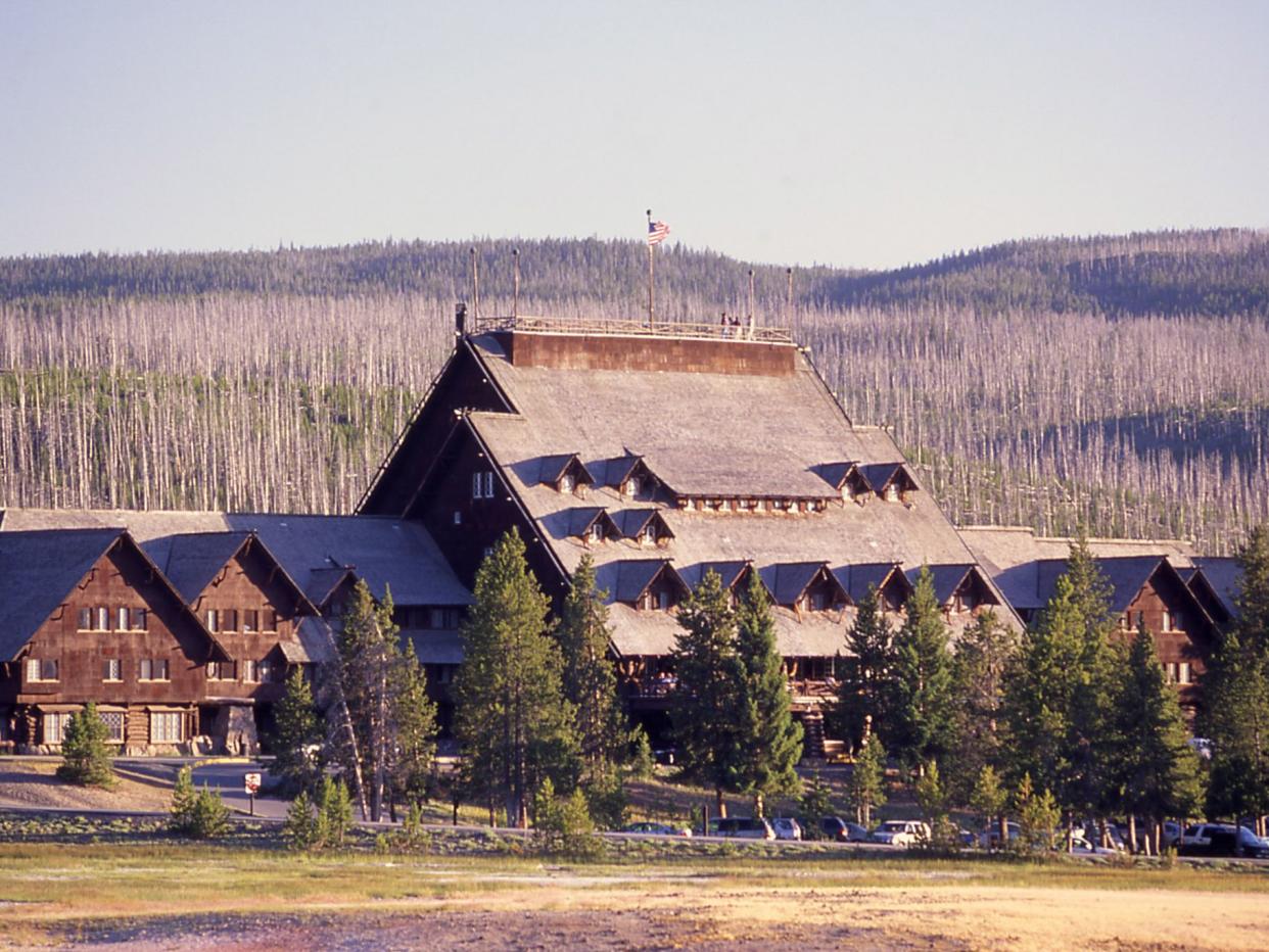 Old Faithful Inn main facade from vicinity of Firehole River, Yellowstone National Park, USA