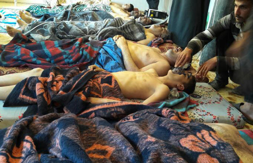 FILE -- In this Tuesday, April 4, 2017 file photo, victims of the suspected chemical weapons attack lie on the ground, in Khan Sheikhoun, in the northern province of Idlib, Syria. Turkey's health minister, Recep Akdag said Tuesday, April 11, 2017, that test results conducted on victims of the chemical attack in Khan Sheikhoun confirm that sarin gas was used. Officials from the World Health Organization and the Organization for the Prohibition of Chemical Weapons participated in the autopsies. (Alaa Alyousef via AP, File)