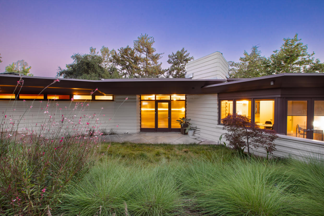  Exterior shot of a bungalow at dusk 