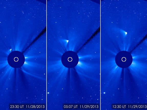 Comet ON appears as a white smear heading up and away from the sun in this SOHO spacecraft view taken on Nov. 28, 2013 after the comet's close solar passage. The comet appears to have survived the fiery flyby, NASA scientists say.