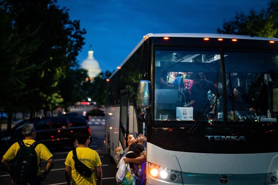 <div class="inline-image__caption"><p>Migrants disembark a bus from Texas within view of the U.S. Capitol on Aug. 11, 2022 in Washington, DC.</p></div> <div class="inline-image__credit">Kent Nishimura/Los Angeles Times via Getty Images</div>